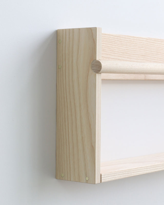 Minimal wall shelf with bar